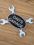 3D printed Dad's Garage crossed wrenches wall plaque in black and white