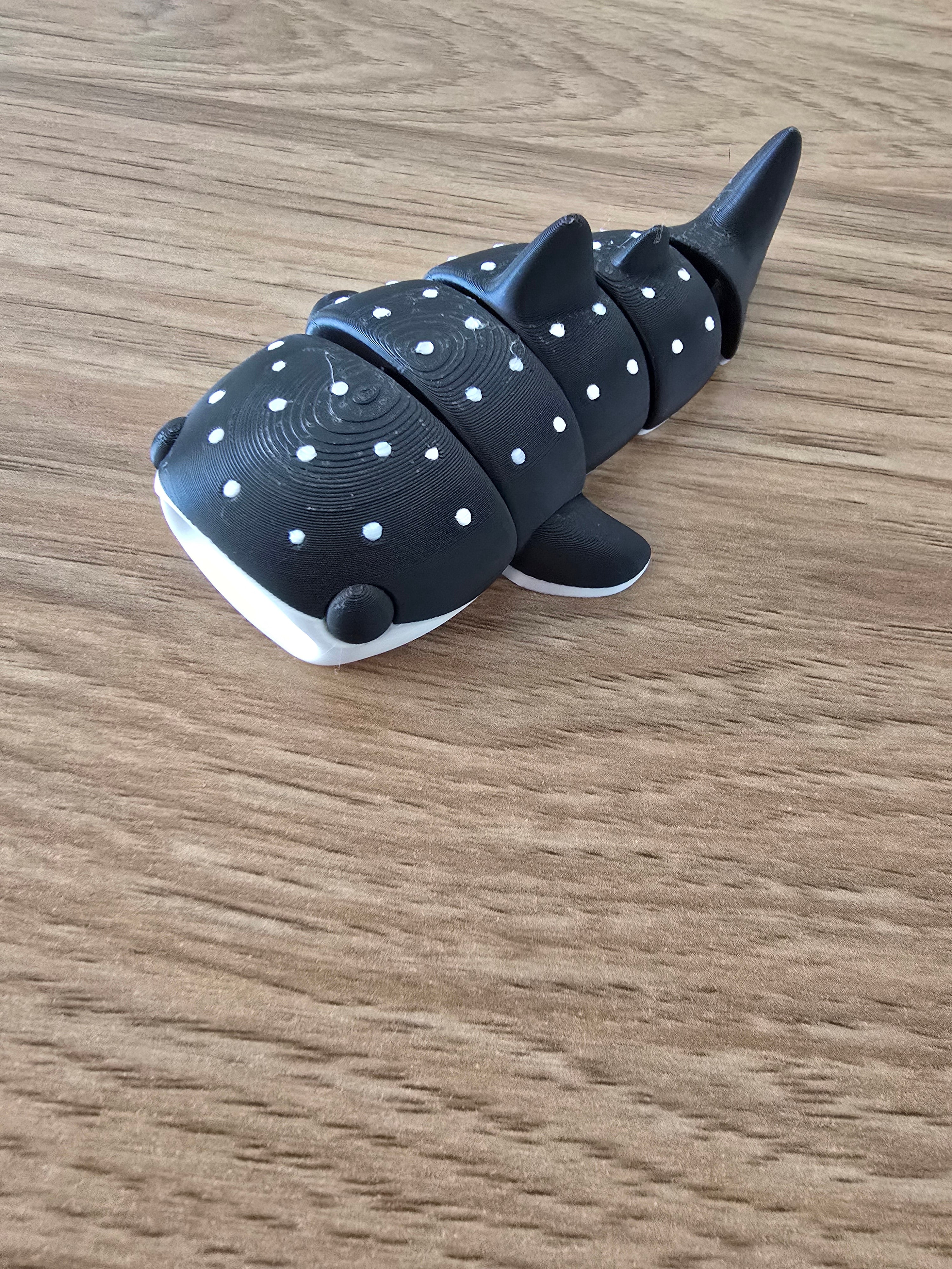 3D printed articulated whale shark fidget toy in black with white spots