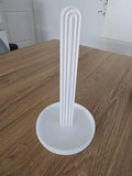 3D printed white ribbed arch hair tie stand on wooden table